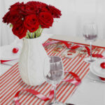 Vase,With,Red,Roses,On,A,Holiday,Served,Table